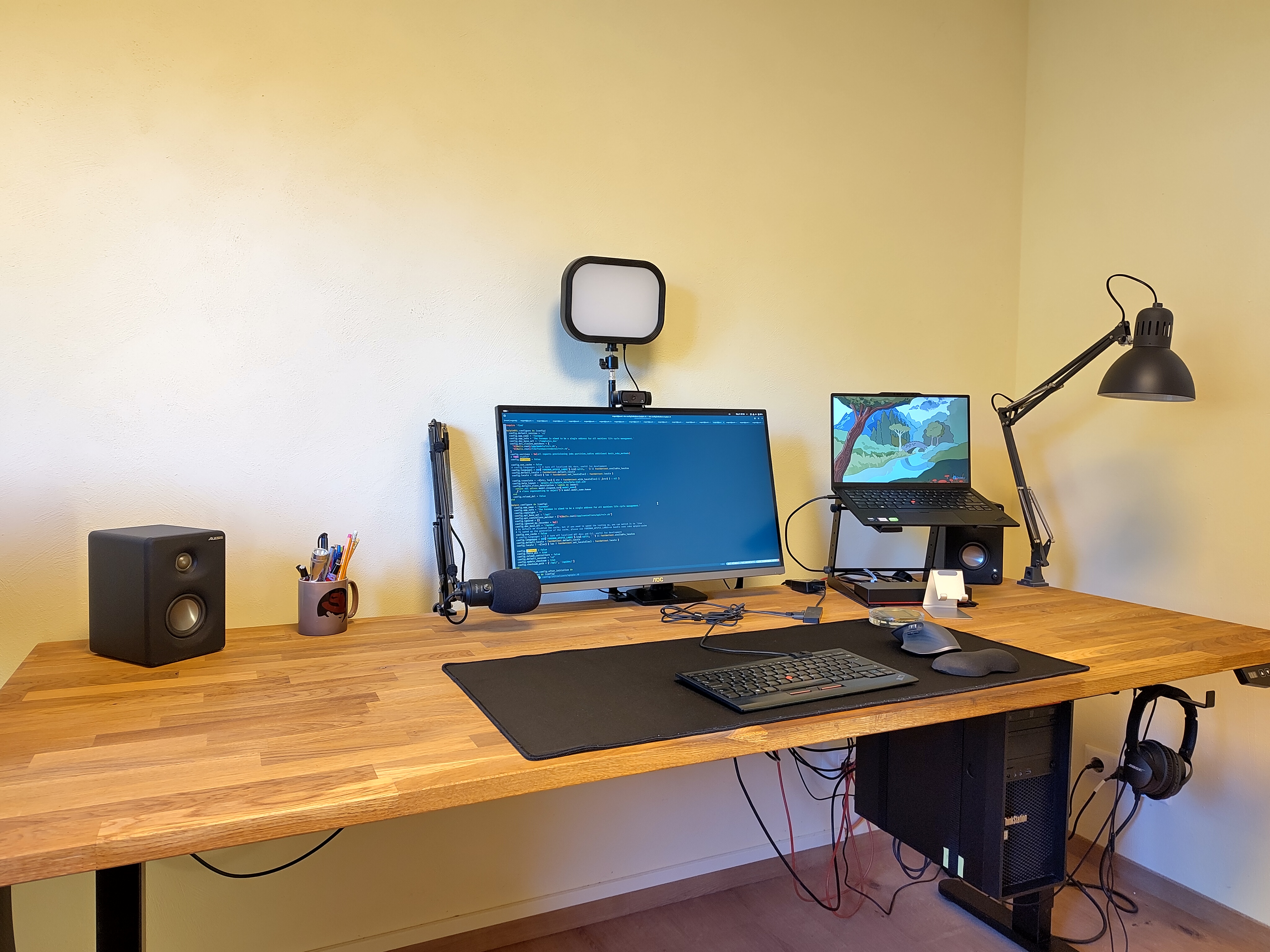 standing desk with a monitor, laptop etc